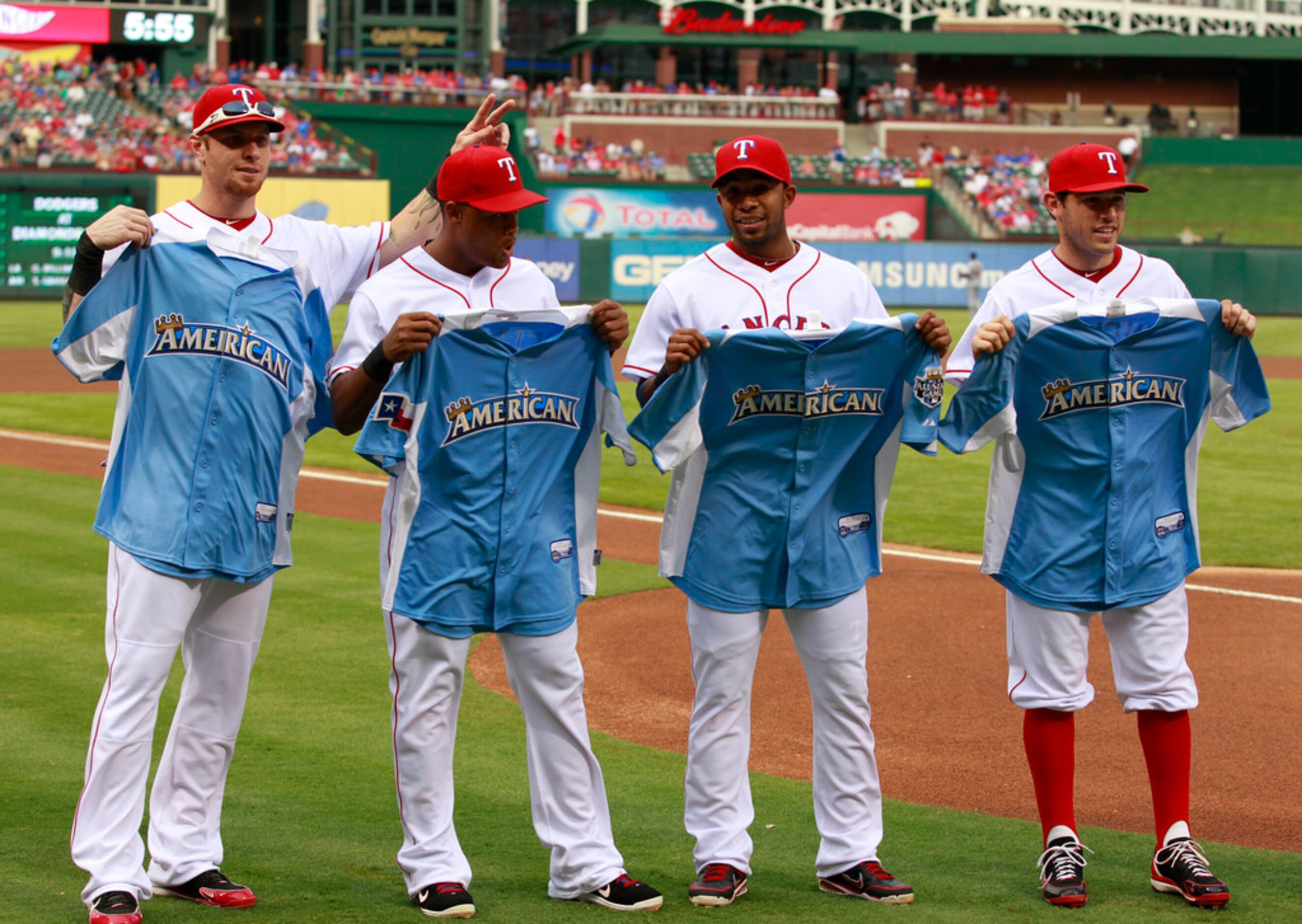 Texas Rangers designated hitter Josh Hamilton (32) third baseman Adrian Beltre (29),...