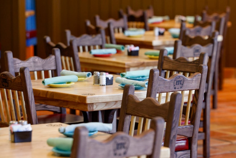 El Tiempo Cantina's chairs and tables are built in a shop in Houston. Each chair has the ETC...