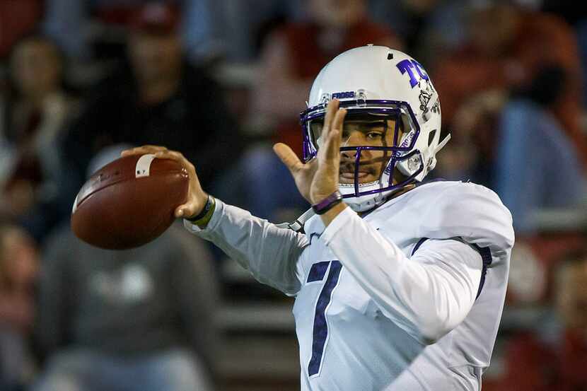 TCU quarterback Kenny Hill warms up before an NCAA football game against Oklahoma in Norman,...