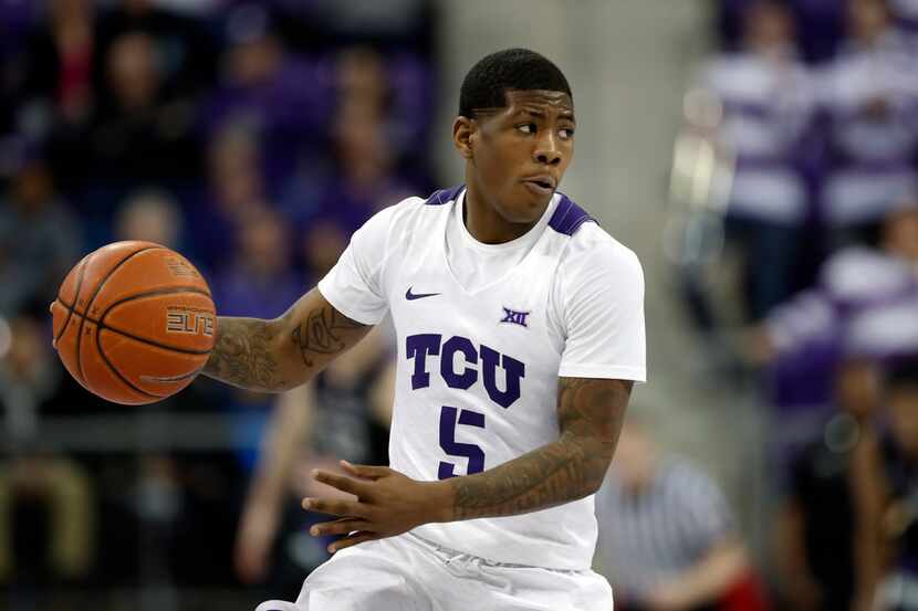 TCU guard Kendric Davis (5) handles the ball during an NCAA college basketball game against...