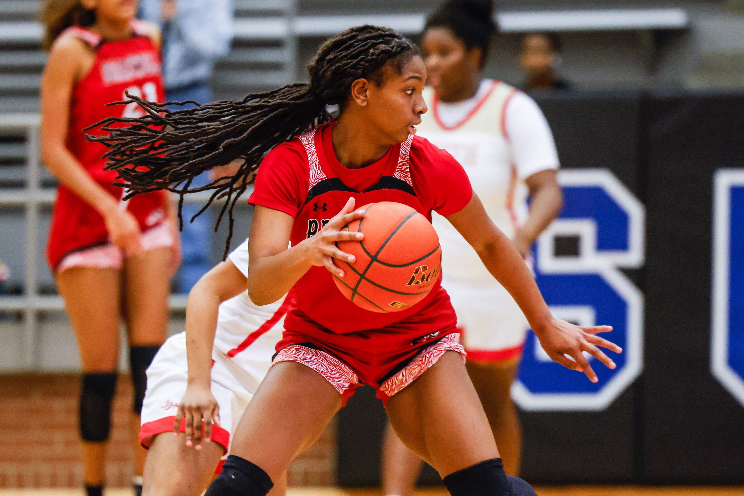 Denton Braswell's Journey Taylor (1) dribbles the basketball against South Grand Prairie...