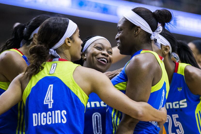 Dallas Wings guard Karima Christmas (13) celebrates with teammates after she fouled Phoenix...