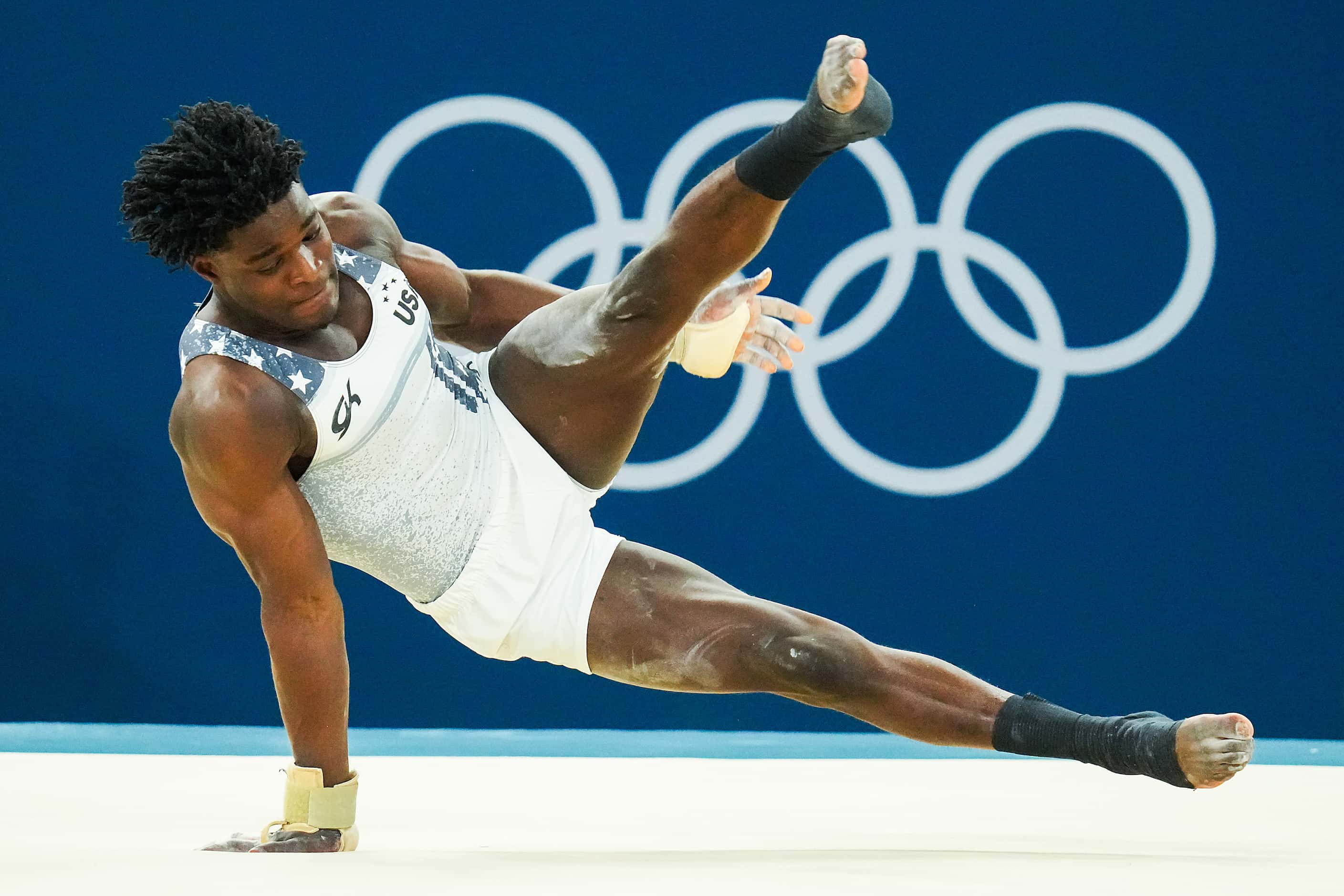 Frederick Richard of the United States works on the floor during gymnastics podium training...
