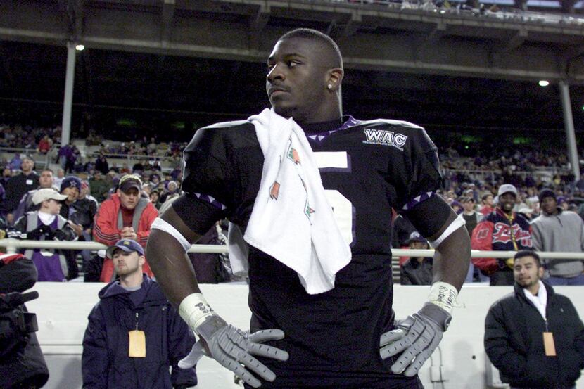 Texas Christian University tailback LaDainian Tomlinson, (5), stands on the sideline and...