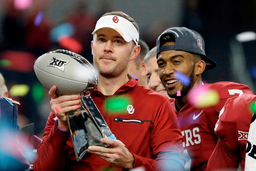 FILE - In this Dec. 2, 2017, file photo, Oklahoma head coach Lincoln Riley holds the Big 12...
