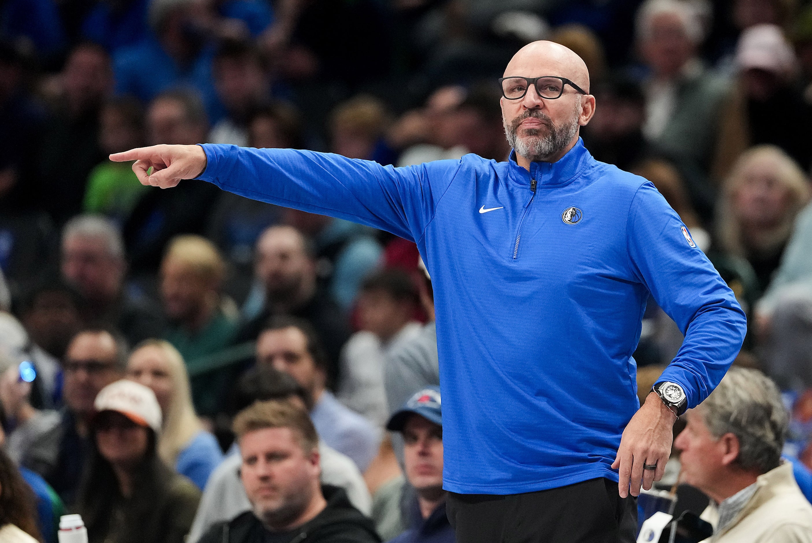 Dallas Mavericks head coach Jason Kidd motions to his team during the first half of an NBA...