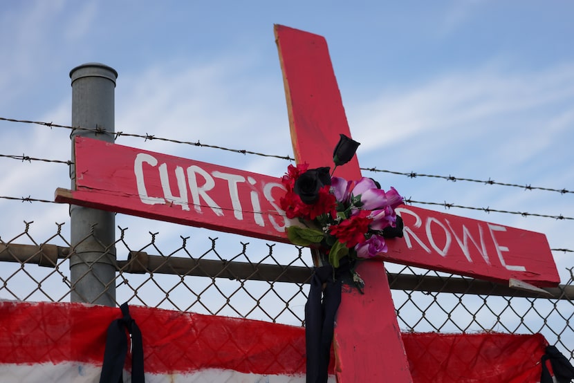 One of six crosses placed along along the fenceline of the the Dallas Executive Airport on...