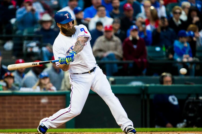 Texas Rangers first baseman Mike Napoli (5) hits a home run during the second inning of an...