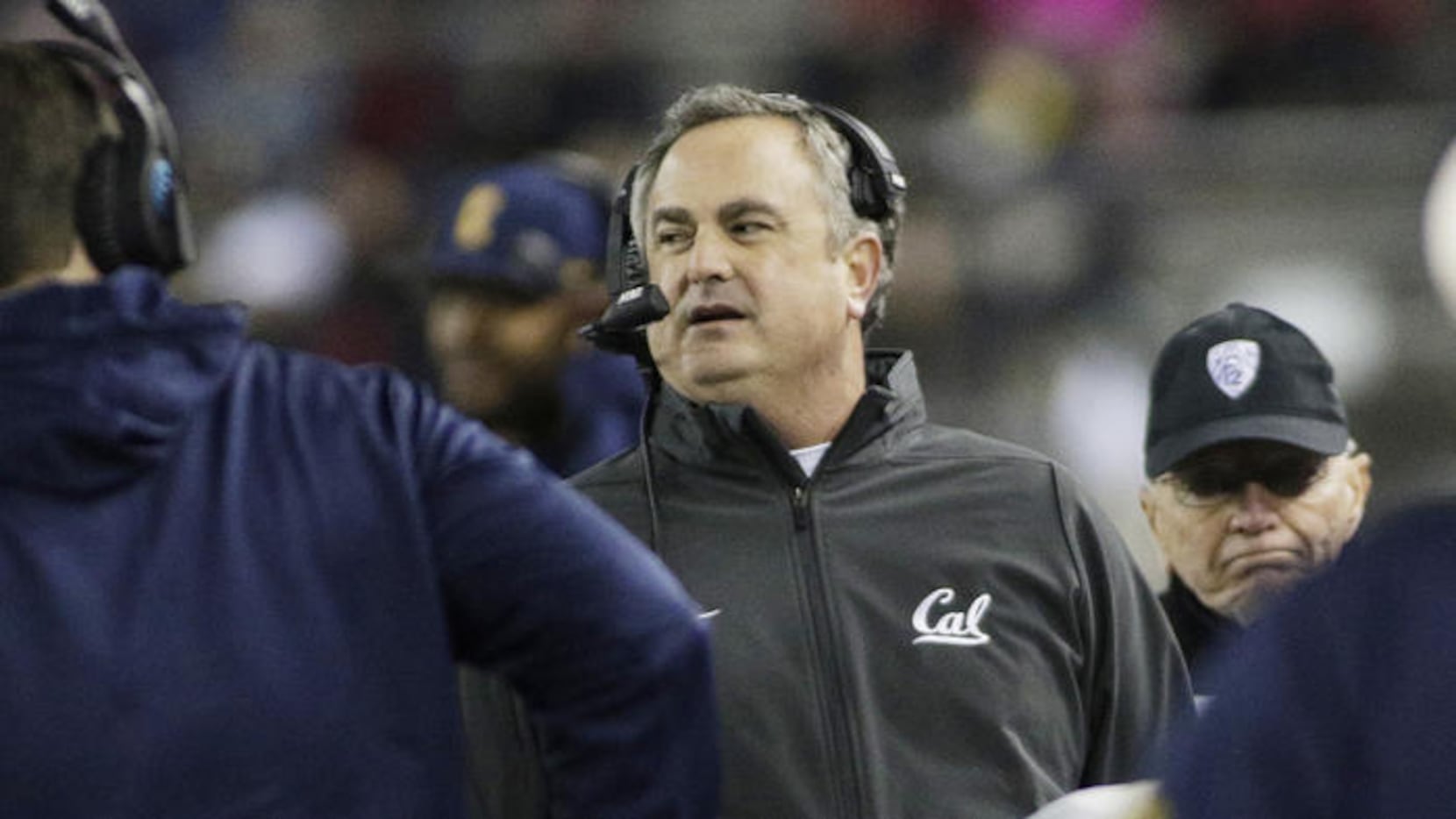 California Coach Sonny Dykes, center, walks along the sideline during the first half of a...