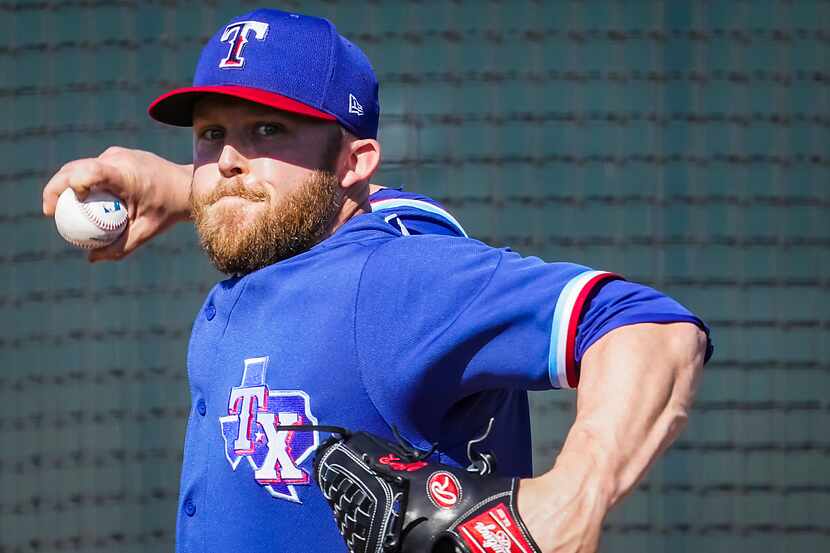 Texas Rangers pitcher Cody Allen throws live batting practice during a spring training...