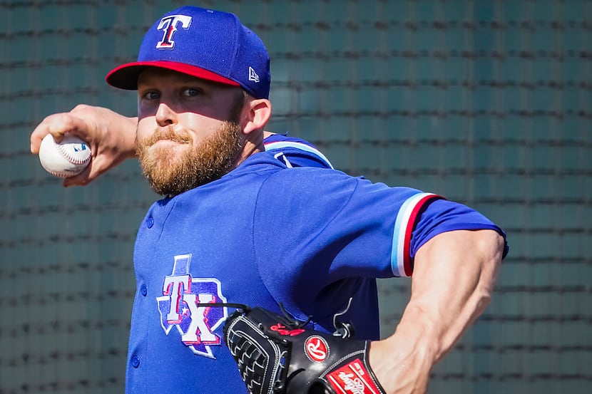 Texas Rangers pitcher Cody Allen throws live batting practice during a spring training...