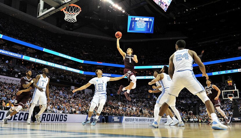 CHARLOTTE, NC - MARCH 18:  DJ Hogg #1 of the Texas A&M Aggies shoots over the North Carolina...