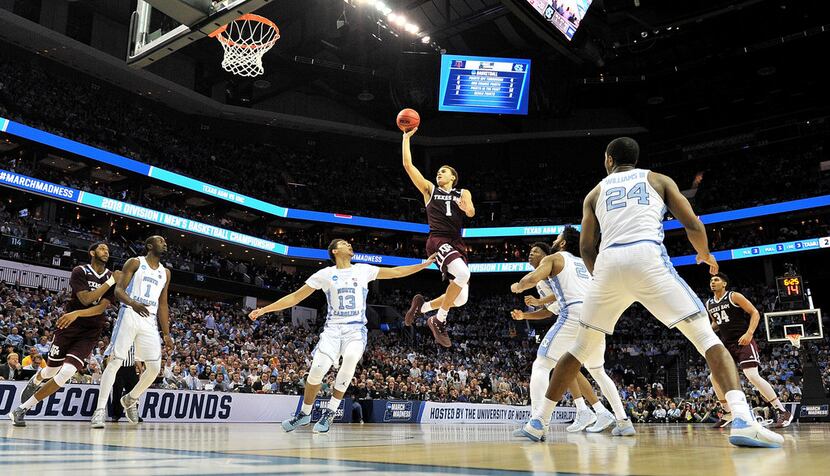 CHARLOTTE, NC - MARCH 18:  DJ Hogg #1 of the Texas A&M Aggies shoots over the North Carolina...