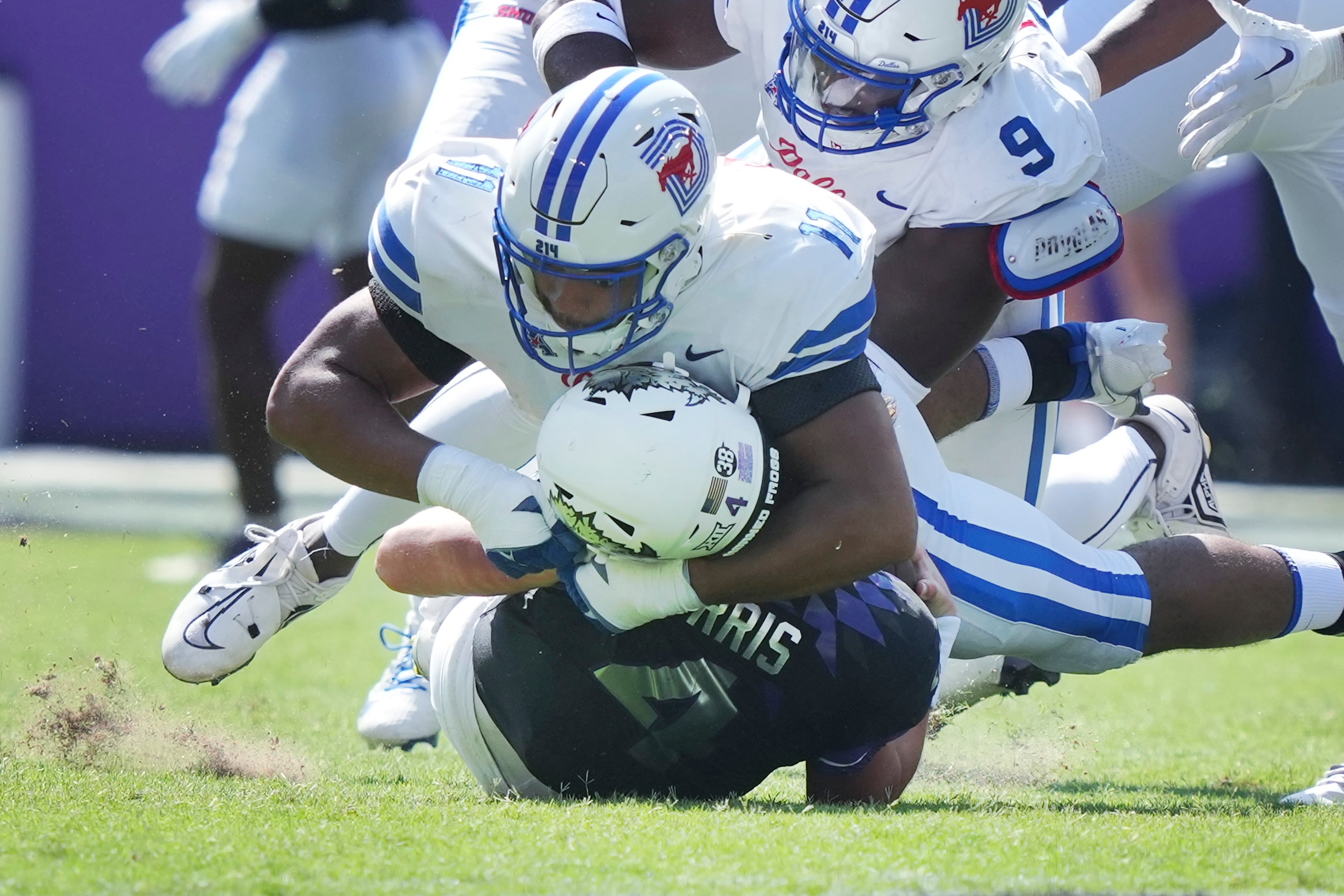 TCU quarterback Chandler Morris (4) is sacked by SMU defensive ends Je'lin Samuels (11) and...