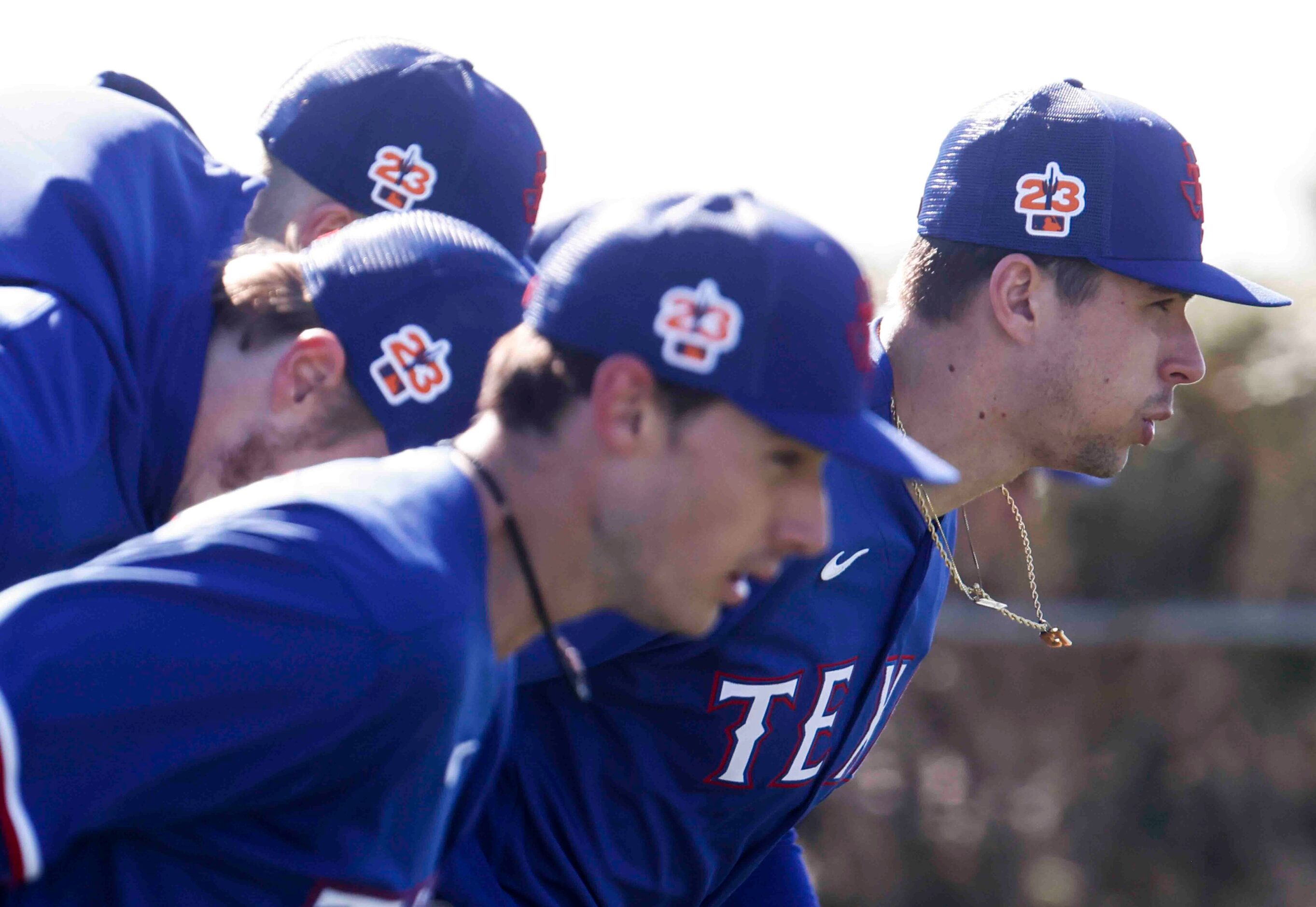 Texas Rangers right handed pitcher Ricky Vanasco, right, runs with teammates during the...