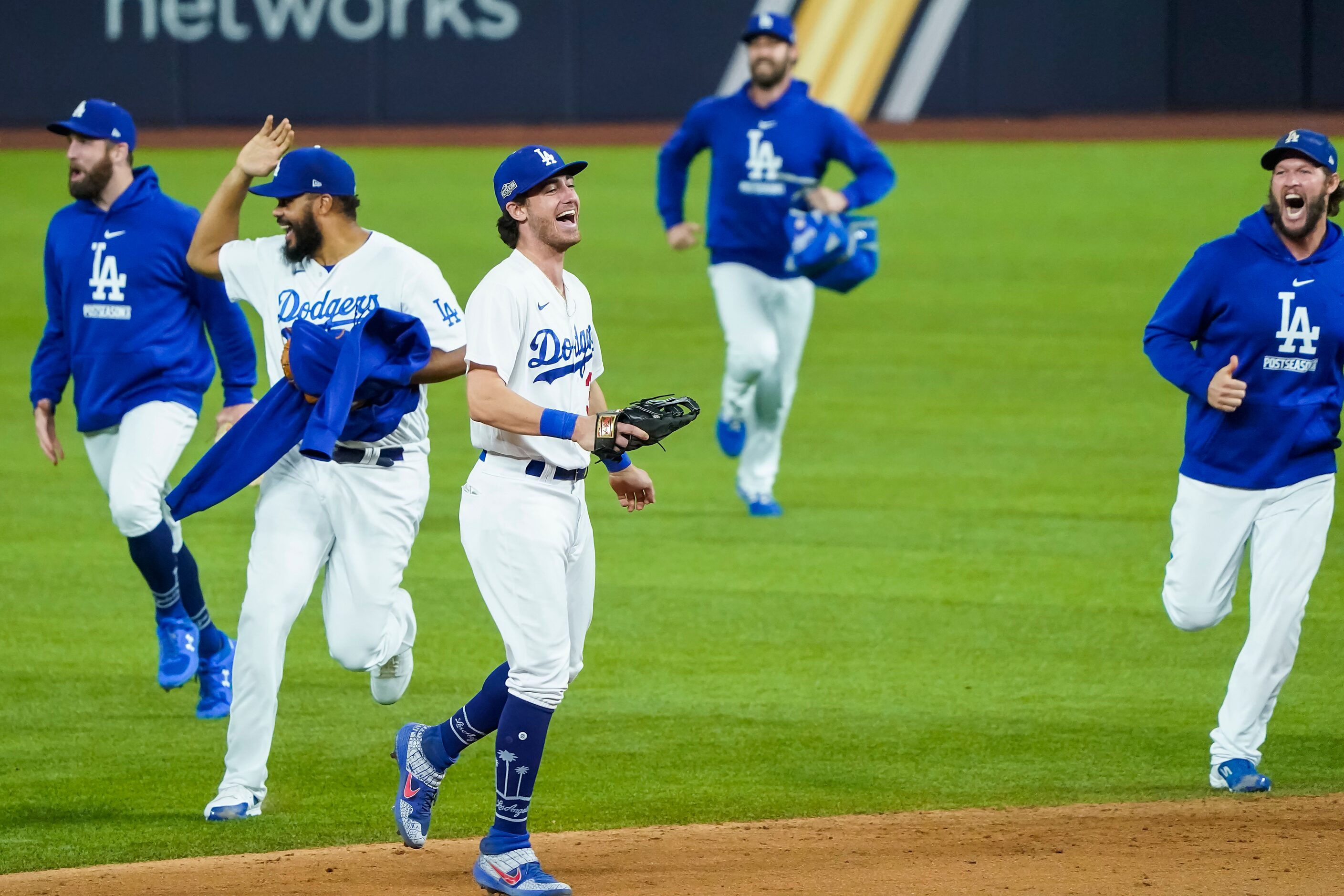 Los Angeles Dodgers center fielder Cody Bellinger (center) celebrates with starting pitcher...