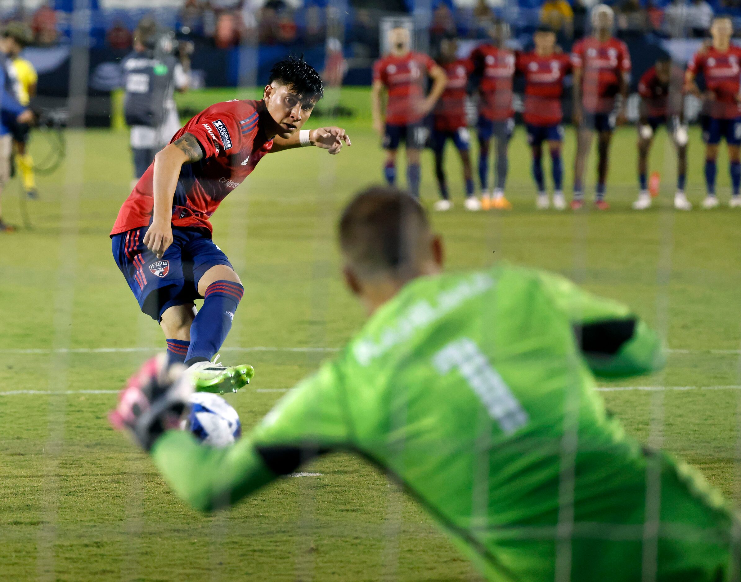 Charlotte FC goalkeeper Kristijan Kahlina (1) stopped FC Dallas defender Marco Farfan’s (4)...