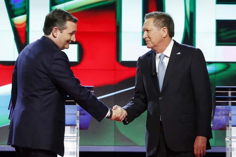  Ted Cruz and John Kasich, shaking hands before a debate at the University of Miami in...