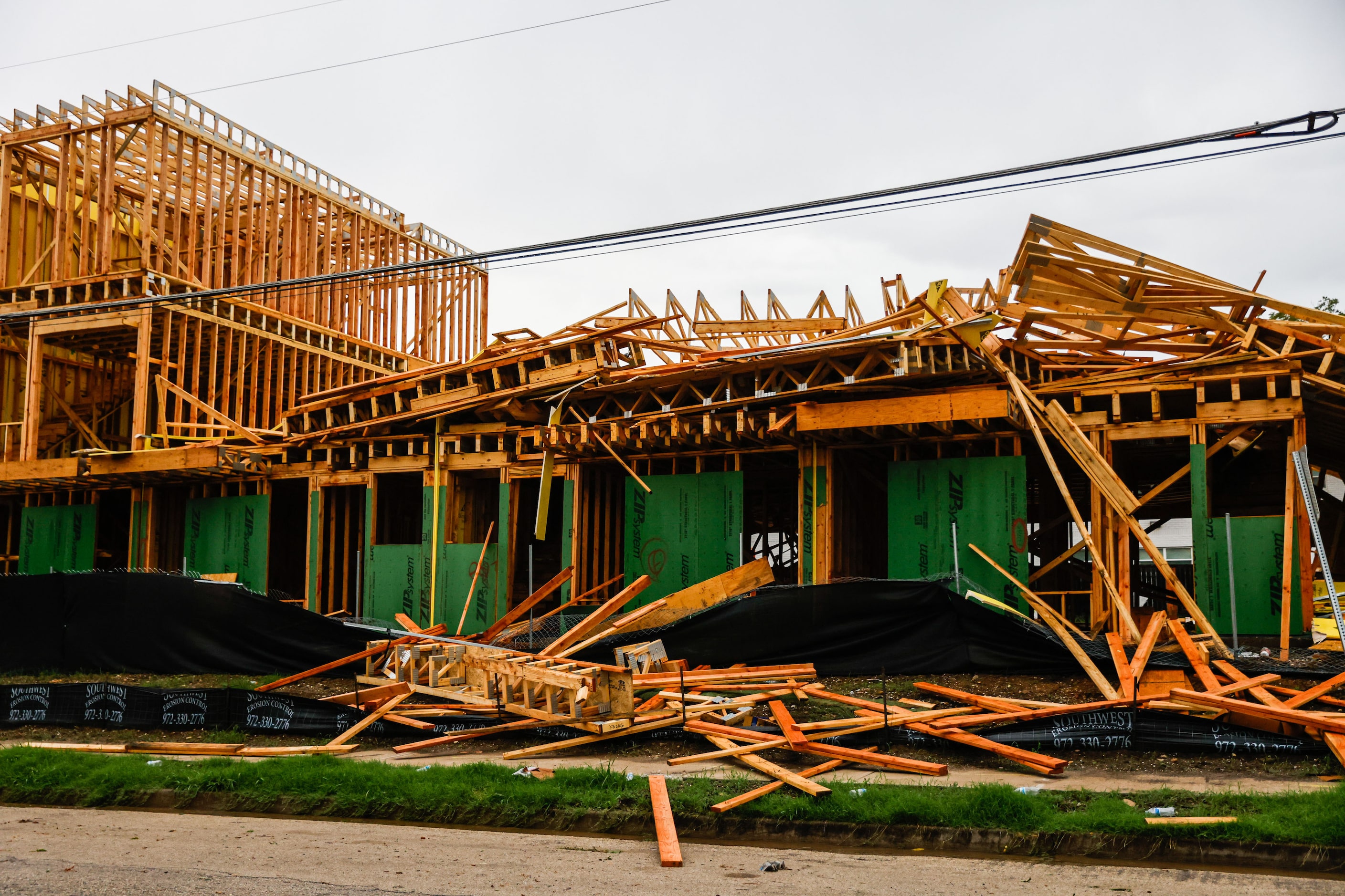 A townhouse construction partially collapsed at Munger Ave and Annex Ave after a severe...