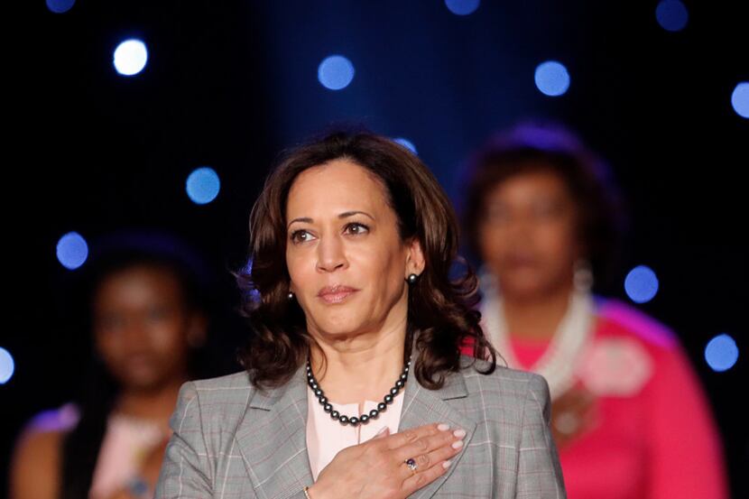 Democratic Presidential Candidate Sen. Kamala Harris, D-Calif., holds her hand to her heart...