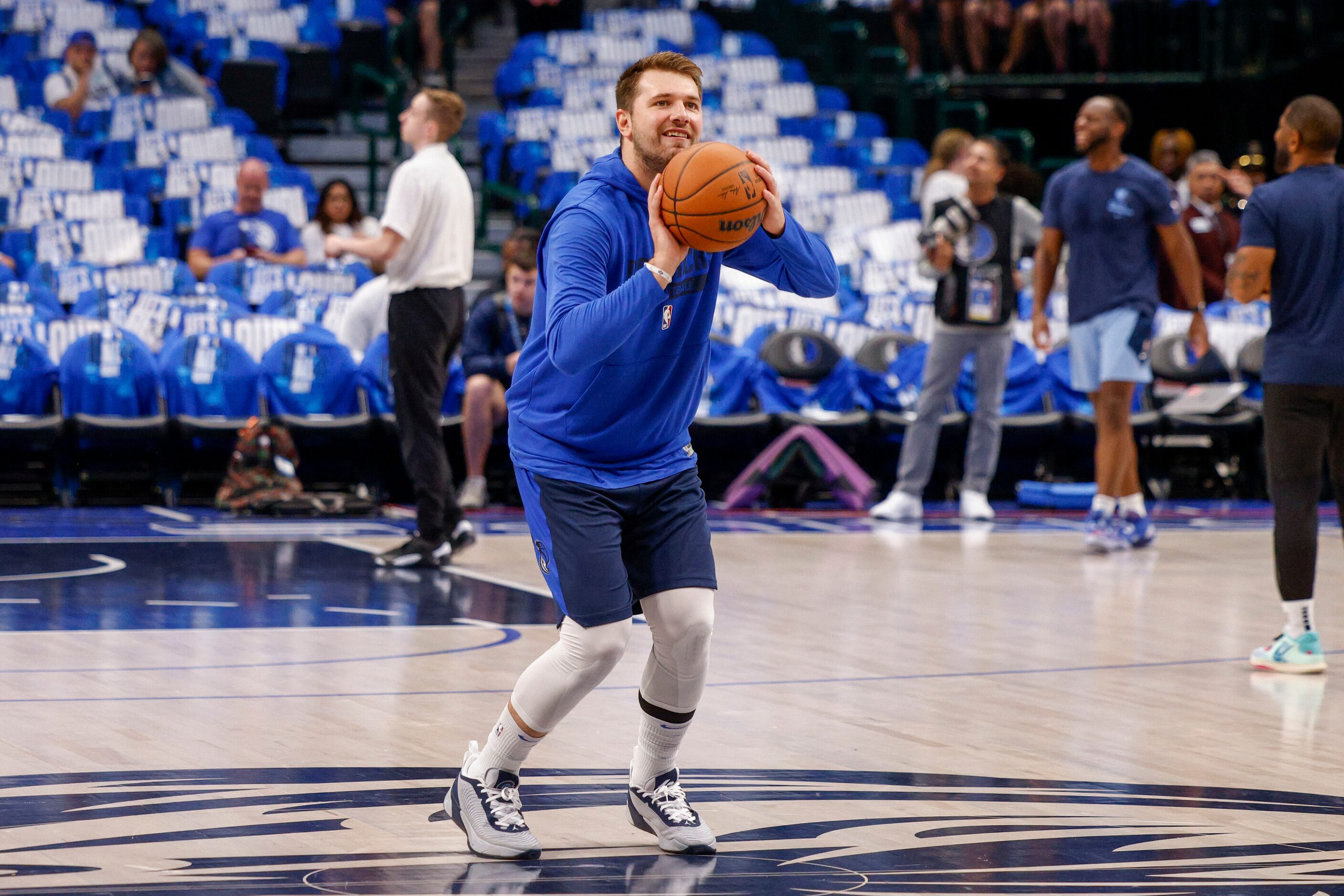 Dallas Mavericks guard Luka Doncic (77) shoots a half-court shot before the Mavs home opener...