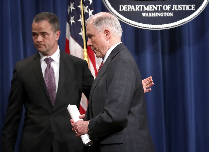 U.S. Attorney General Jeff Sessions departs following a press conference at the Department...