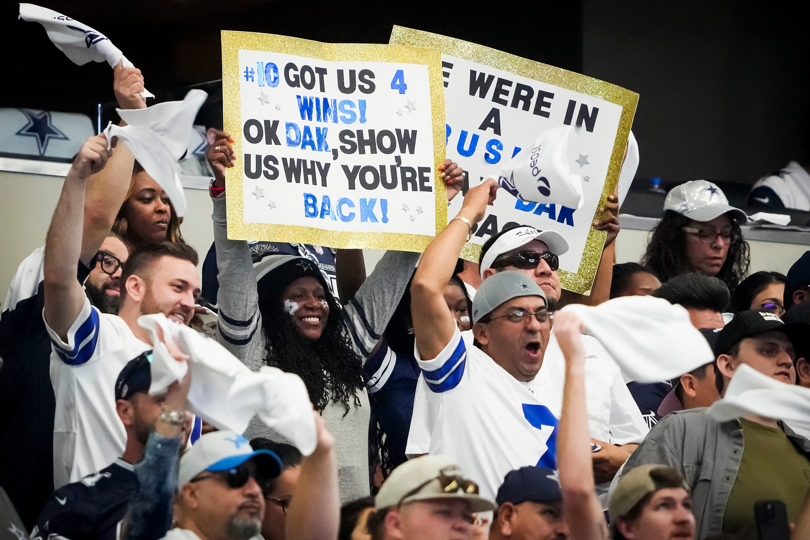 Dallas Cowboys fans cheer quarterback Dak Prescott during the first quarter of an NFL...