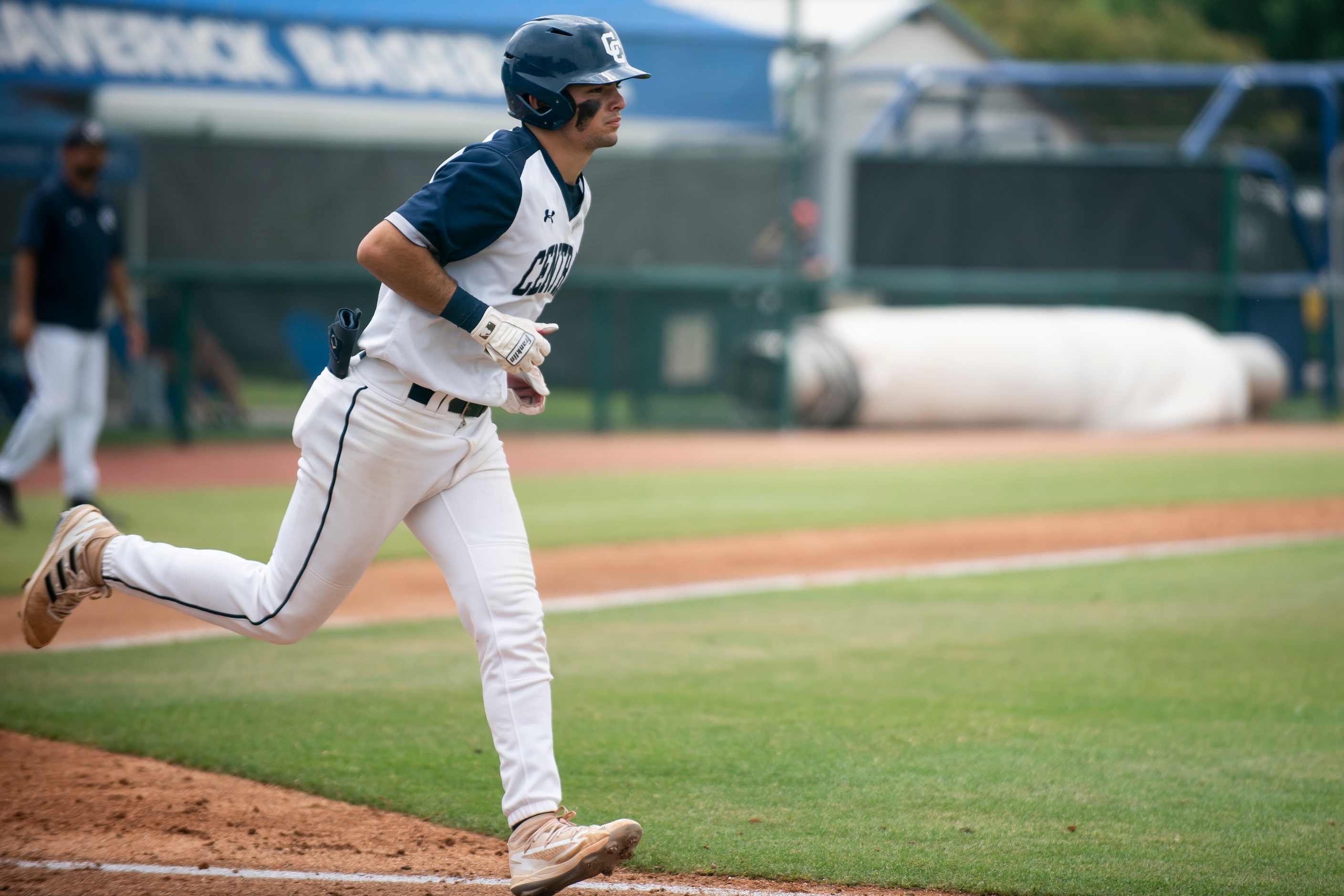 Central Catholic senior Anthony DeJesus (21) jogs down to first base after drawing a walk...