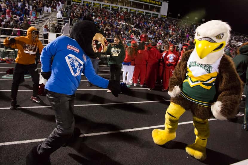 The Duncanville Panther and DeSoto Eagle mascots have a dance battle during a District 7-6A...