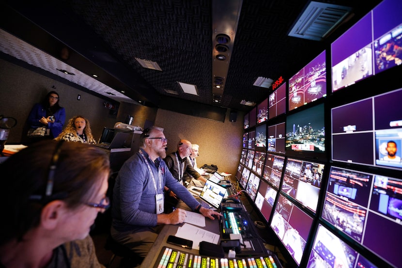 Clay Armstrong, director of MavsTV, second from left and Dave Keeney, executive producer of...