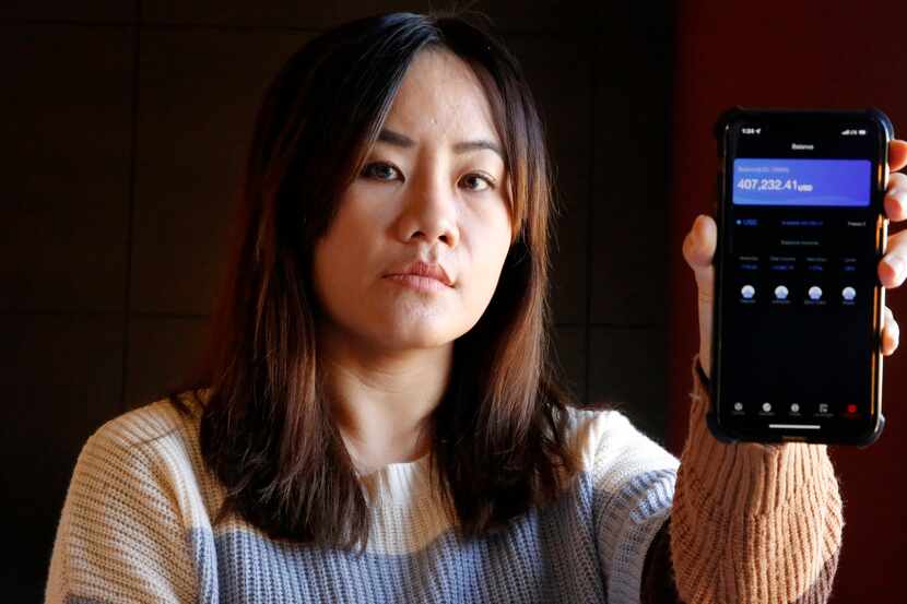 Yik Li of Carrollton shows a screenshot of the value of her crypto account, which rose in...