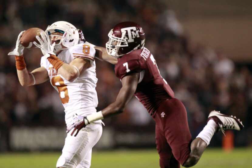 FILE - Texas wide receiver Jaxon Shipley (8) catches a pass over Texas A&M defensive back...