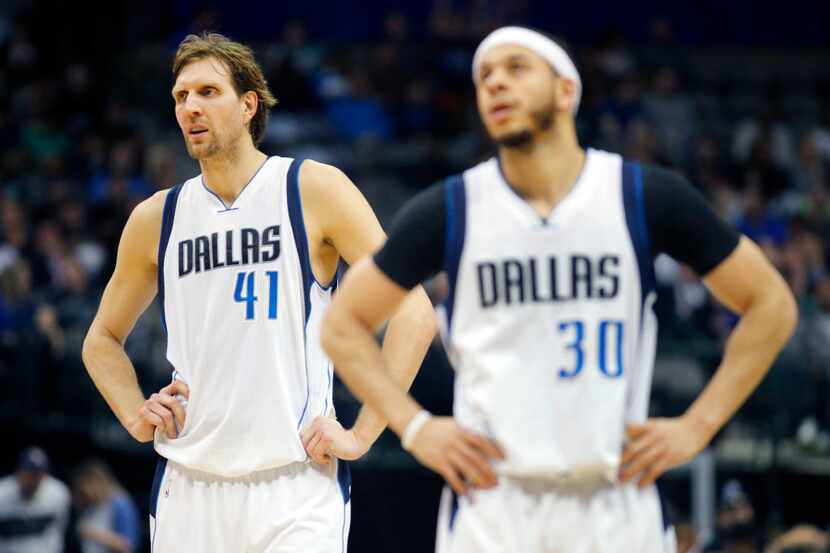 Dallas Mavericks forward Dirk Nowitzki (41) and Dallas Mavericks guard Seth Curry (30) wait...