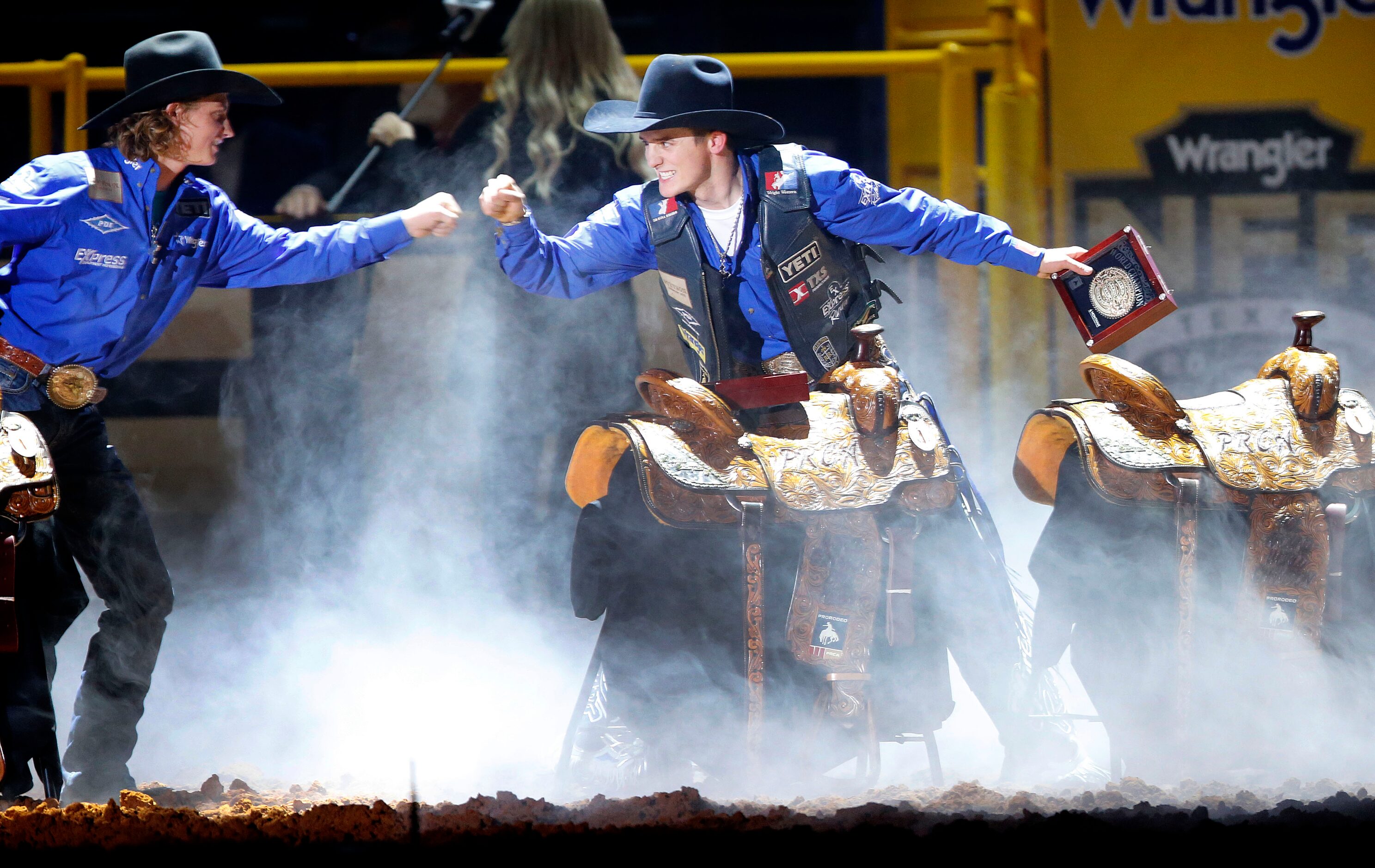 Bull Riding Champion Stetson Dell Wright (right) of Milford, Utah celebrates winning the...