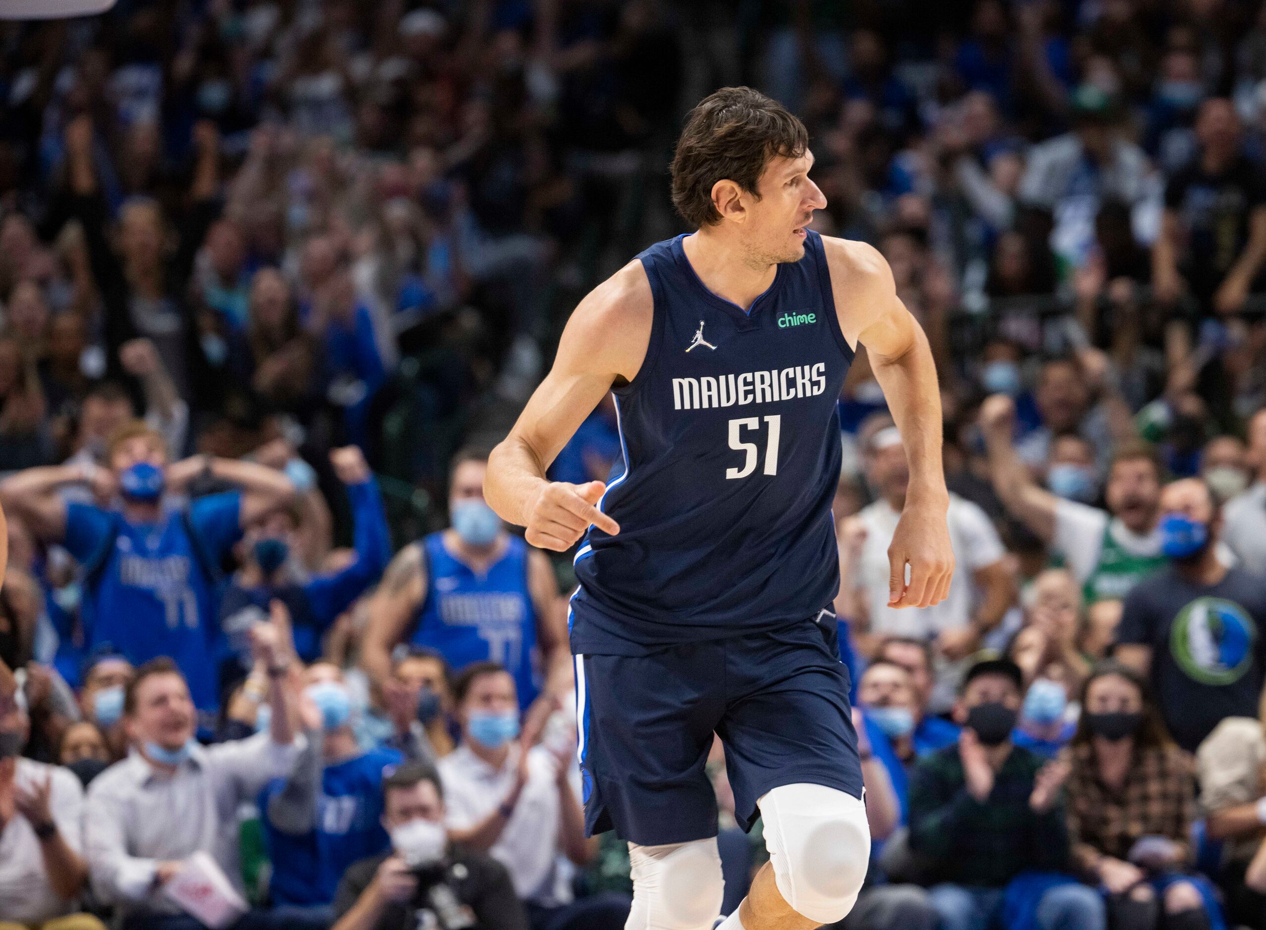 Dallas Mavericks center Boban Marjanovic (51) celebrates a shot during the first quarter of...