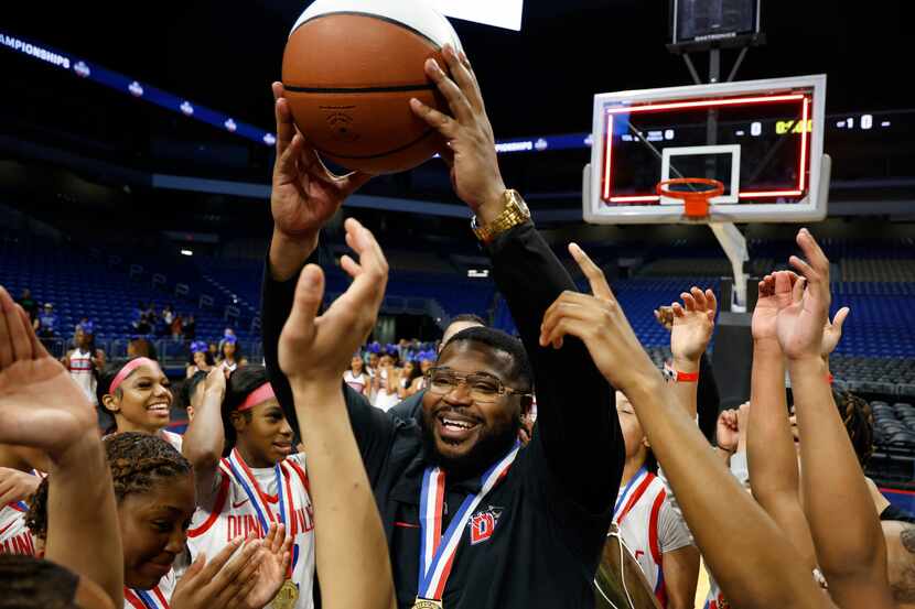 Duncanville coach Neiman Ford celebrates after the Class 6A girls basketball state...