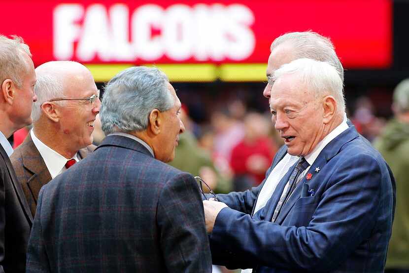 Dallas Cowboys owner Jerry Jones and Atlanta Falcons owner Arthur Blank visit on the field...
