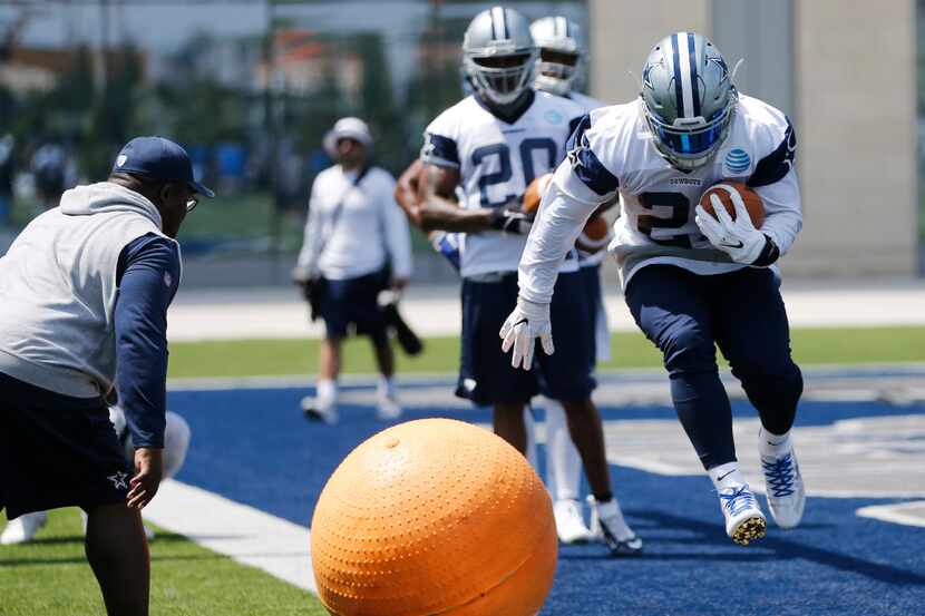 Dallas Cowboys Ezekiel Elliot (21) leaps during a drill in OTA's at the Star in Frisco on...