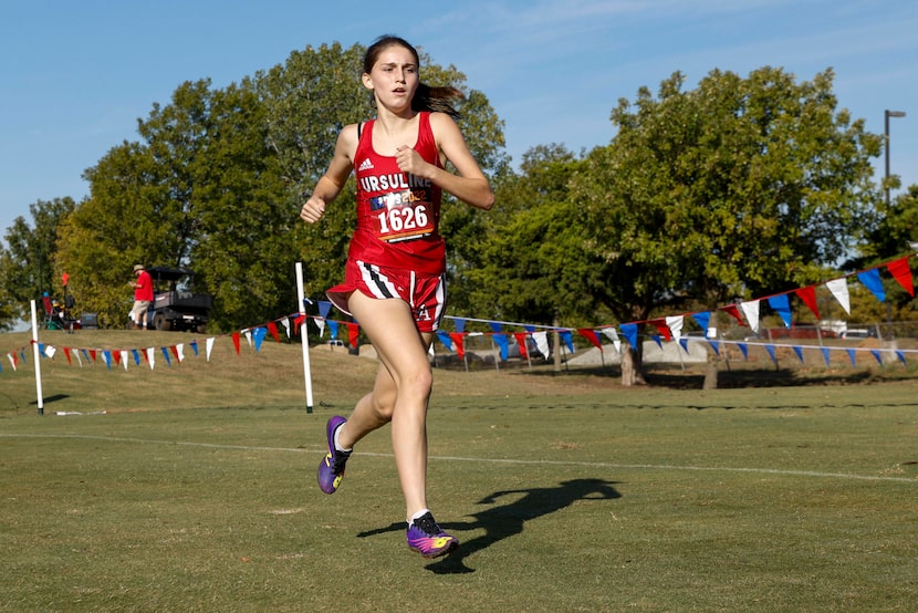 Ursuline Academy’s Presley Andras competes during the TAPPS class 6A girls state cross...