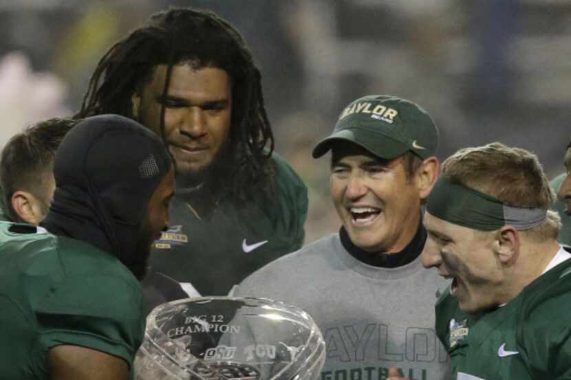 Baylor head coach Art Briles celebrates with players Ahmad Dixon (from left), Cyril...