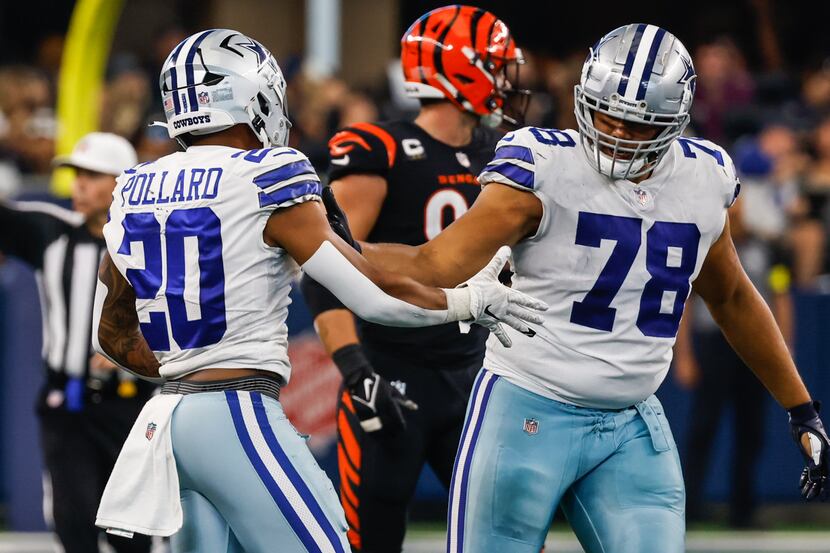 Dallas Cowboys running back Tony Pollard (20) celebrates a first down with offensive tackle...