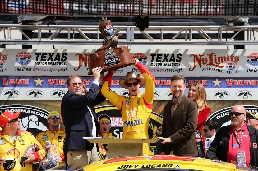 
Joey Logano, driver of the #22 Shell-Pennzoil/Hertz Ford, celebrated in Victory Lane with...