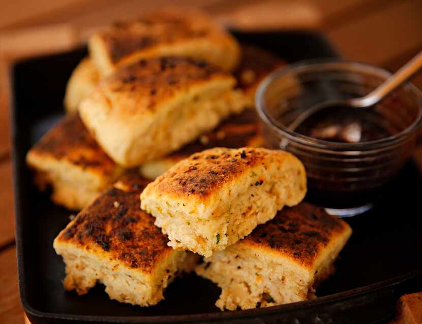 Chef Ken Rathbun's ancho chili-lime biscuits, garnished with a cherry preserve, photographed...