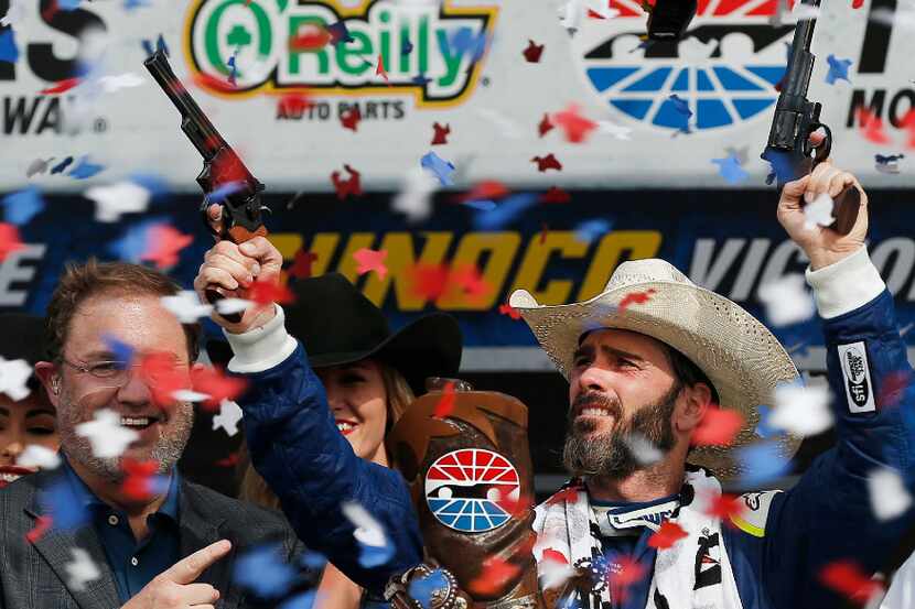 NASCAR driver Jimmie Johnson, right, celebrates winning the O'Reilly Auto Parts 500 at Texas...