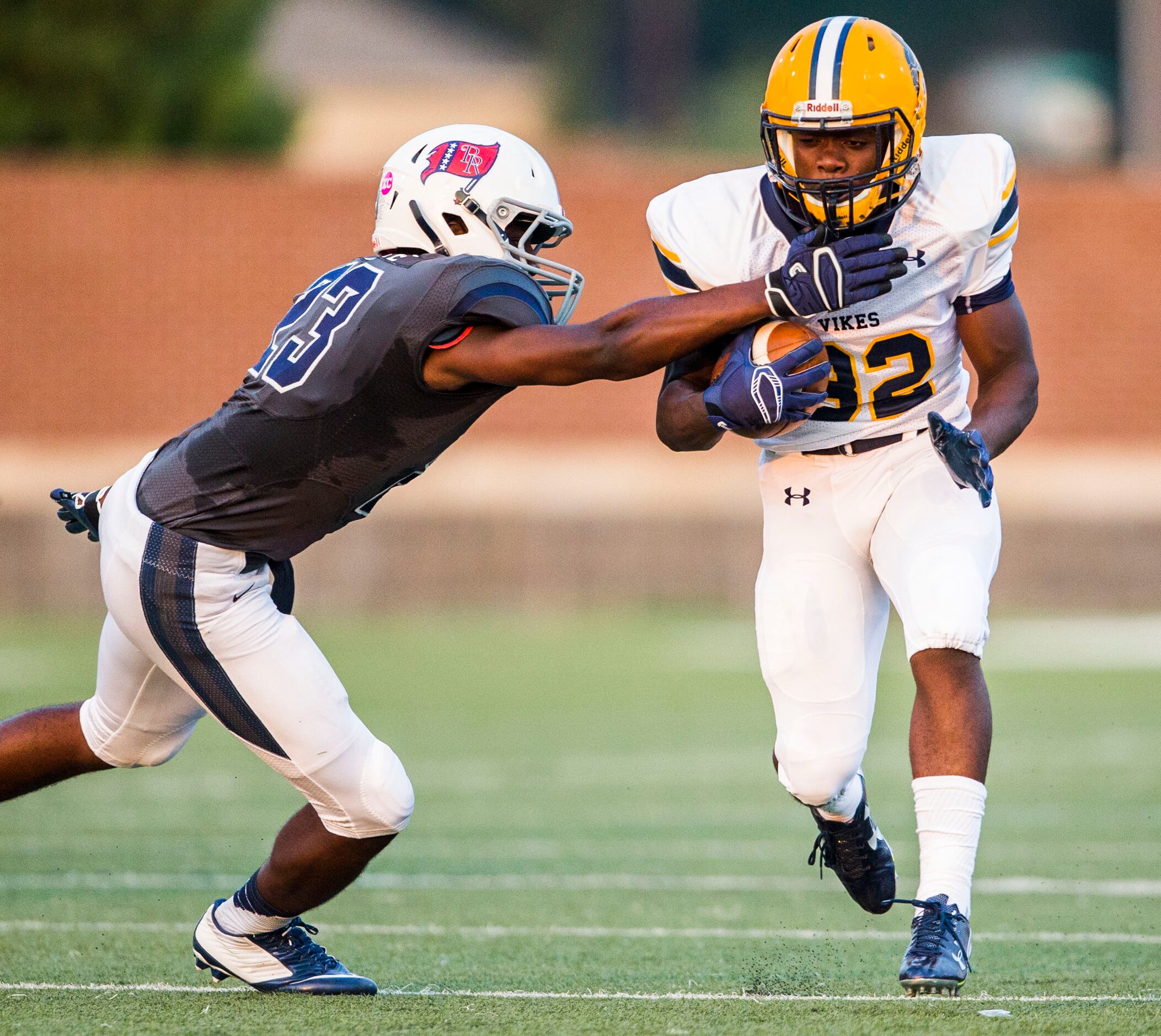 Arlington Lamar High School running back Rashod Polk (32) is tackled by Richland High...