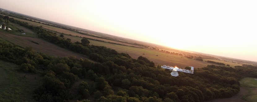 Wing's drone has a 3-foot wing span and weighs 10.6 pounds. It's photographed here holding a...