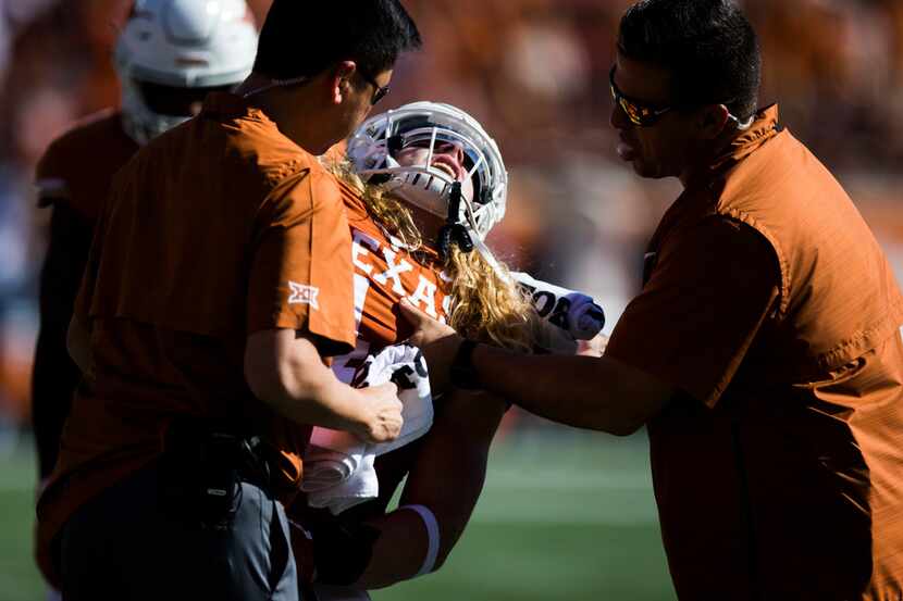 Texas Longhorns defensive lineman Breckyn Hager (44) reacts to an injury during the first...