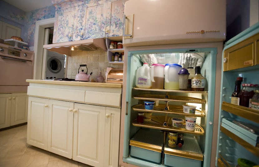 Lee and Melissa Higginbotham own a working vintage 1956-57 GE fridge and a GE stove and oven...
