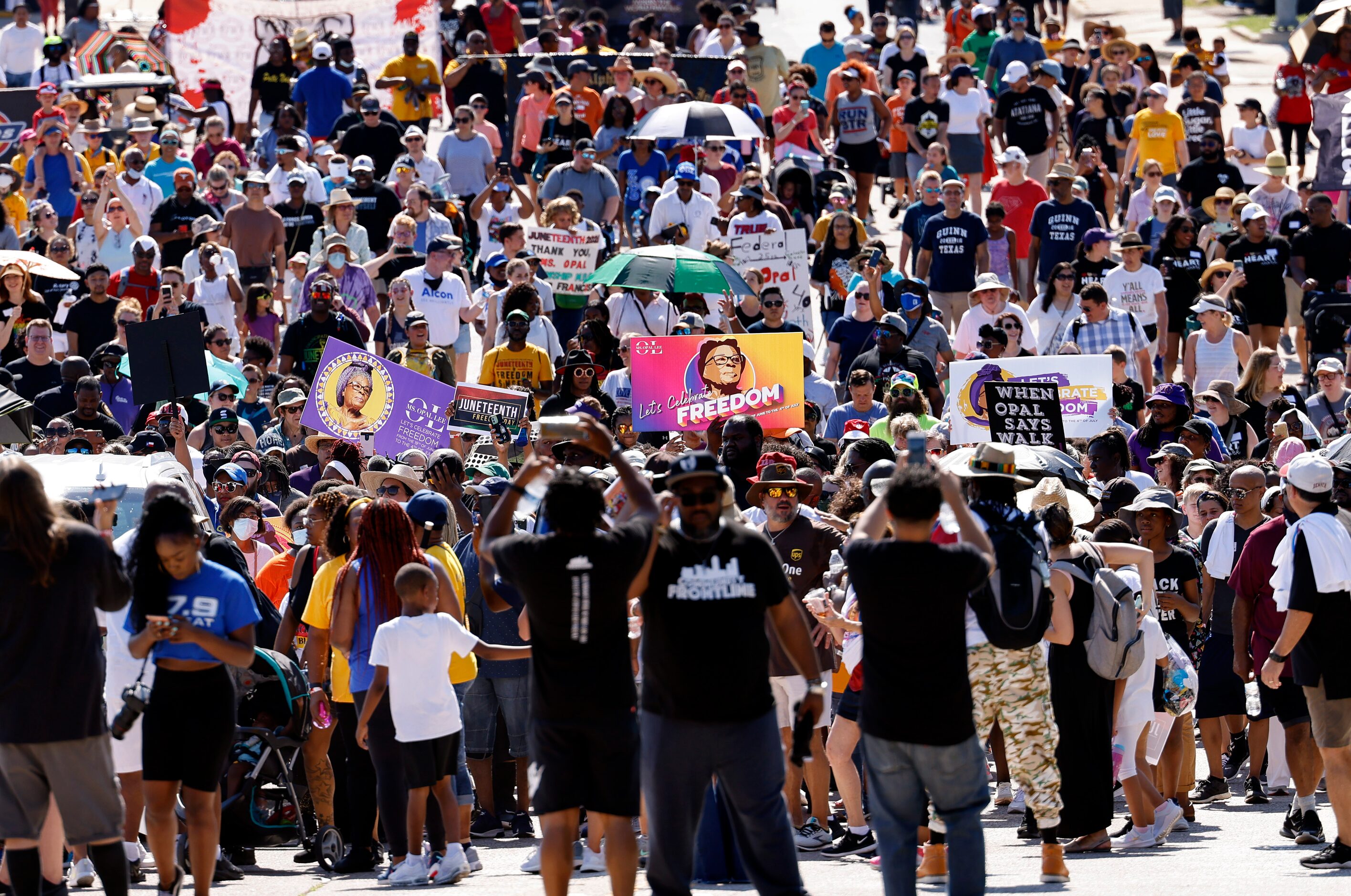 Supporters of Opal Lee and her Juneteenth walk event make the hot holiday trek through the...