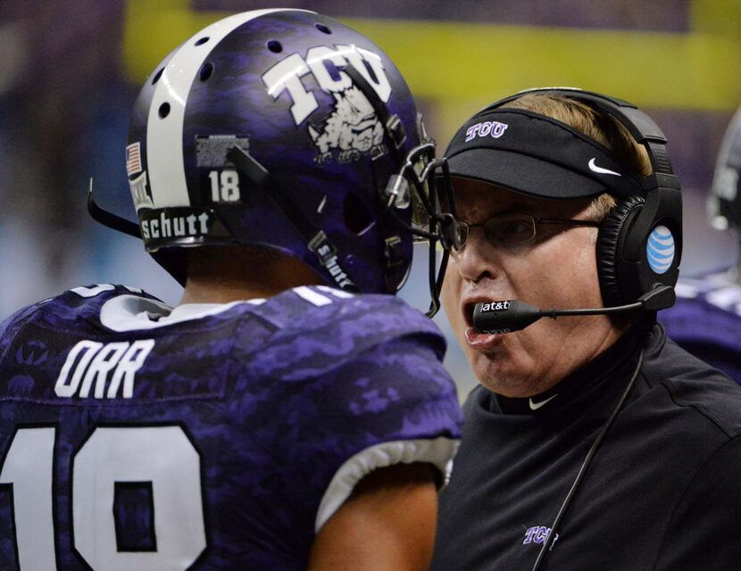 Jan 2, 2016; San Antonio, TX, USA; TCU Horned Frogs head coach Gary Patterson (right), talks...